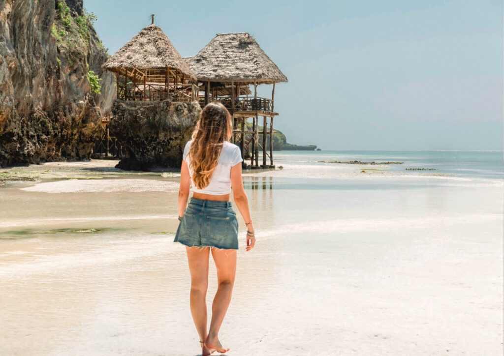Solo traveller enjoying a sunny walk in nungwi zanzibar tanzania 2026